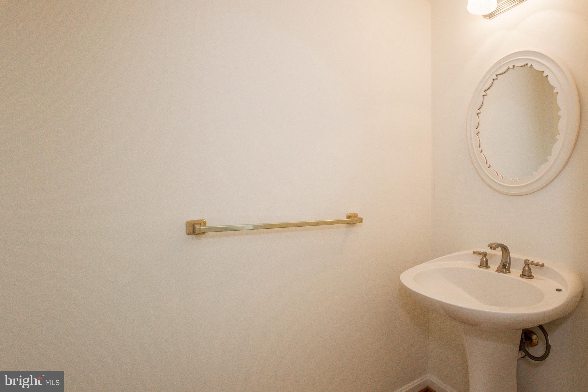 8402 Shadeland Road Laurel, MD 20724 - Photo 12 of 30 a bathroom with a sink and a mirror