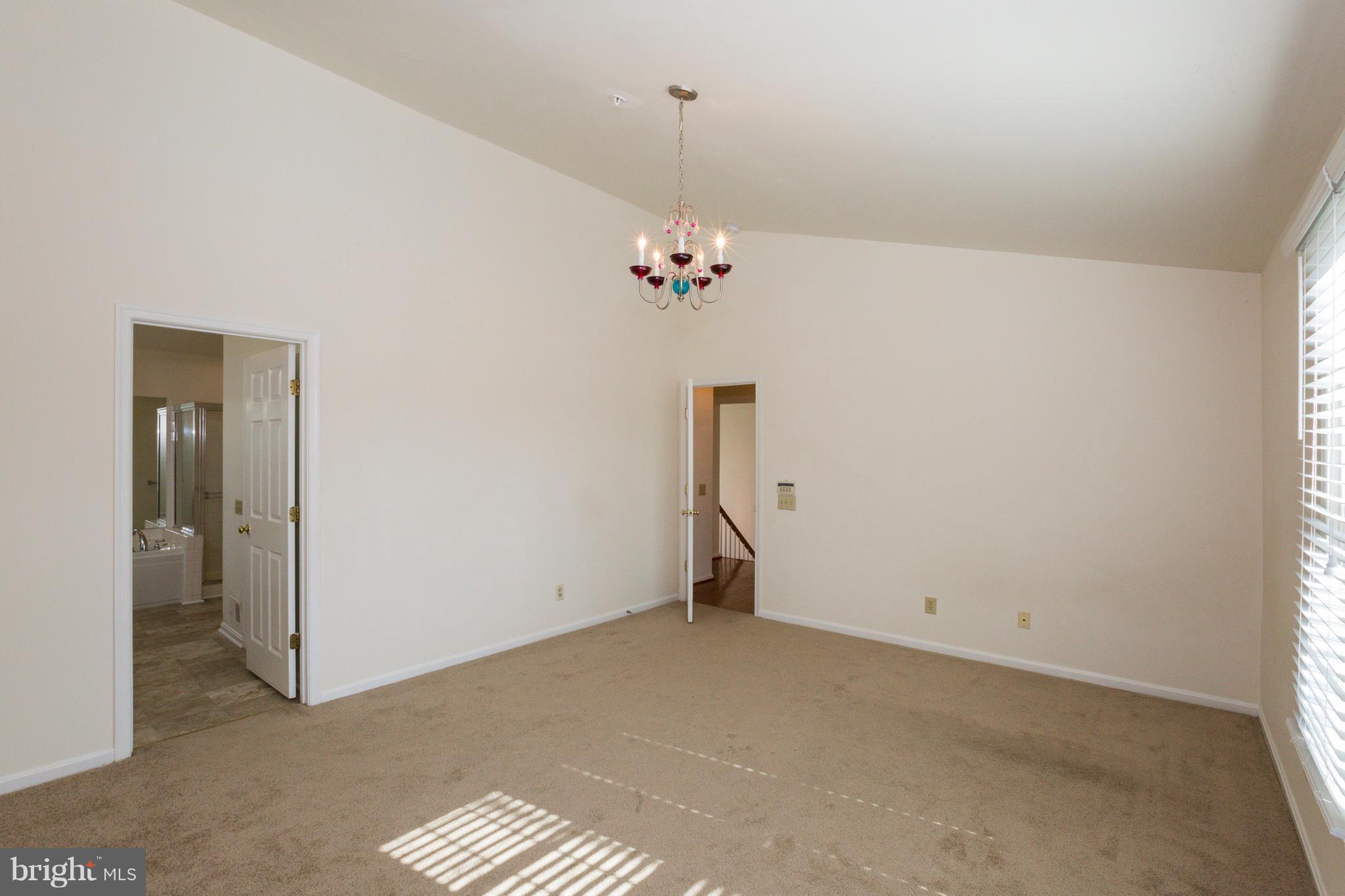 8402 Shadeland Road Laurel, MD 20724 - Photo 17 of 30 a view of a chandelier fan and hardwood floor