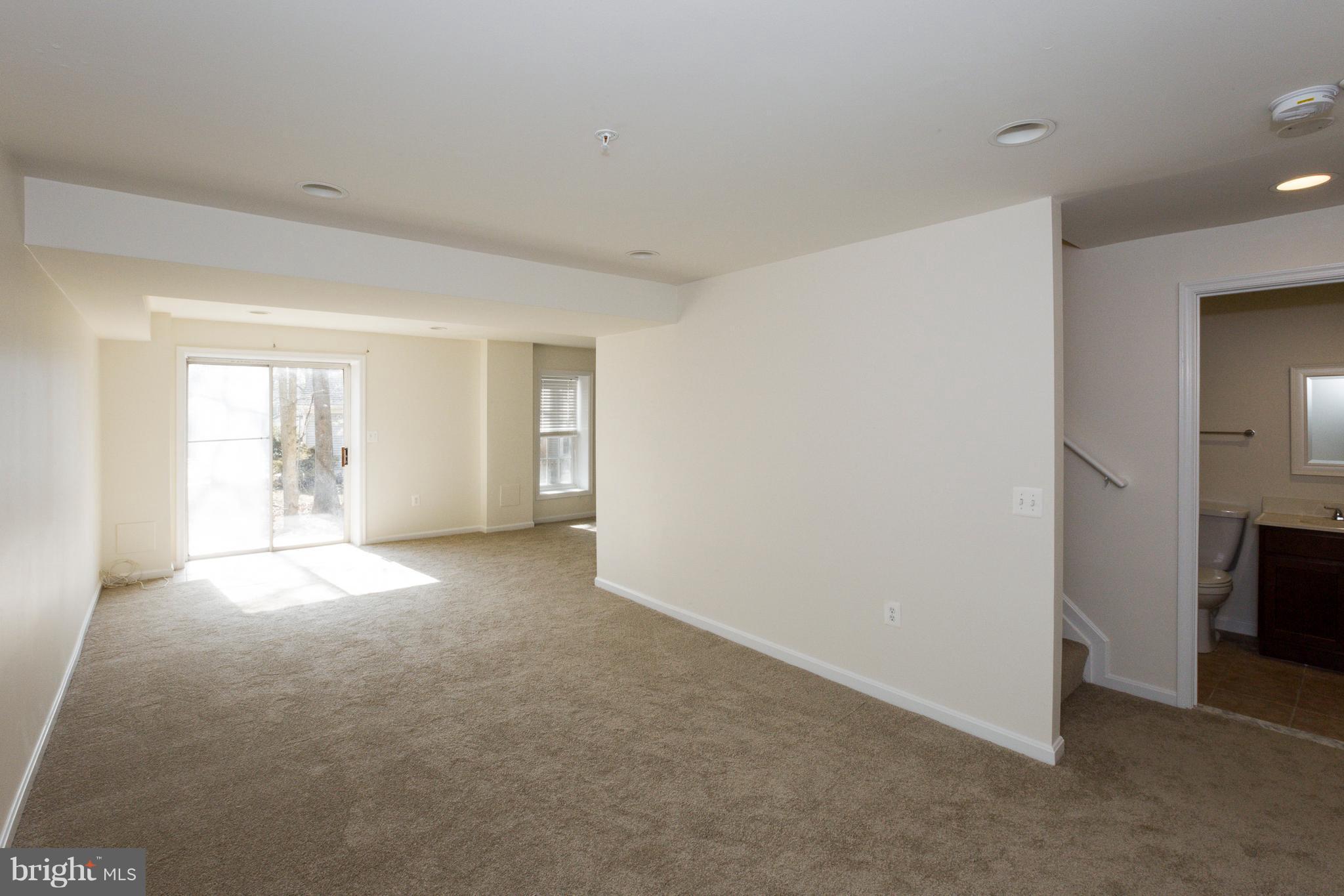 8402 Shadeland Road Laurel, MD 20724 - Photo 26 of 30 a view of empty room with windows and fireplace