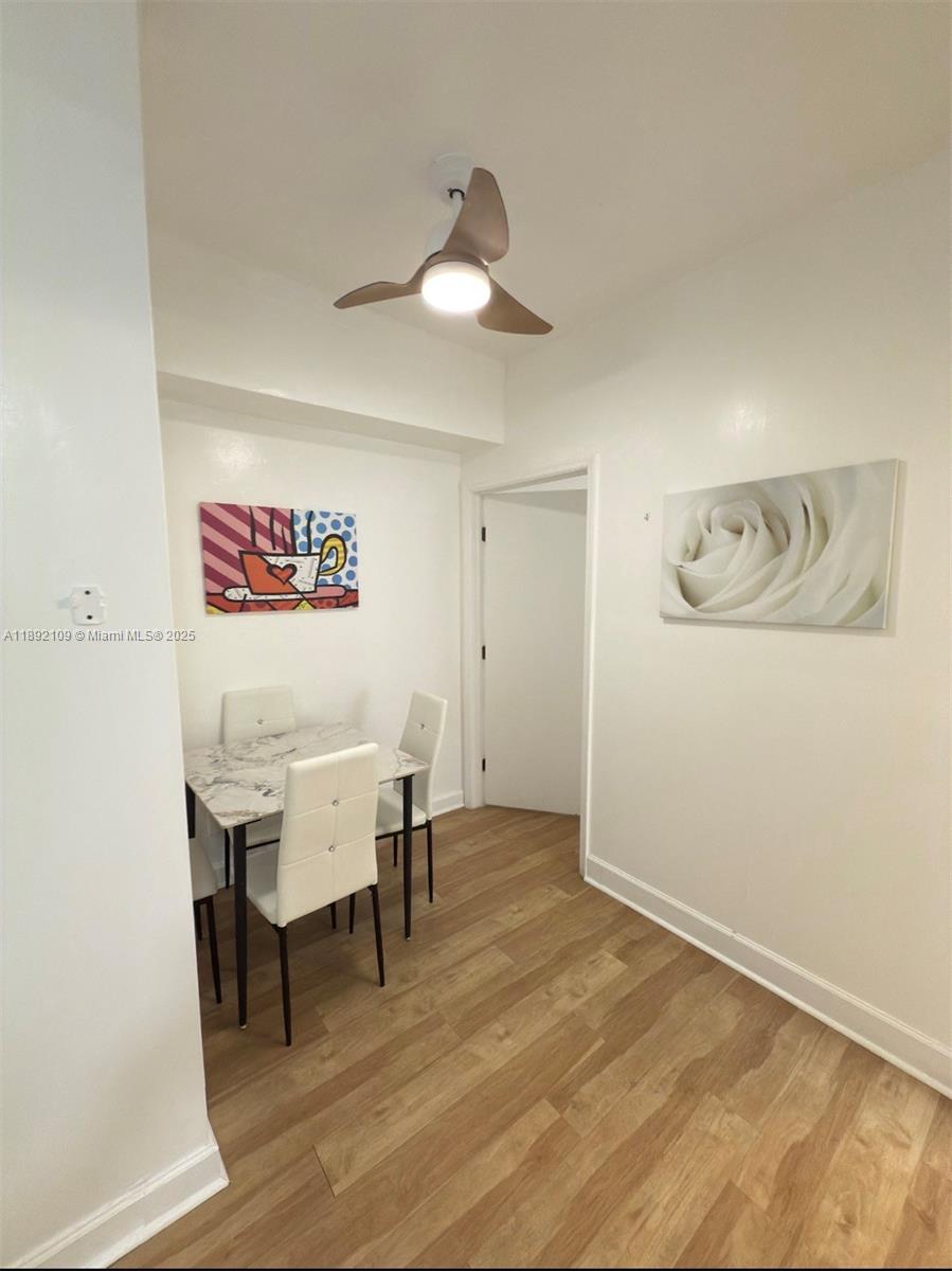 545 Michigan Avenue, Unit 1 Miami Beach, FL 33139 - Photo 11 of 12 a view of a room with furniture and wooden floor