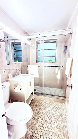 a bathroom with a toilet a sink and a bathtub