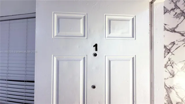 a bathroom with a shower and a sink