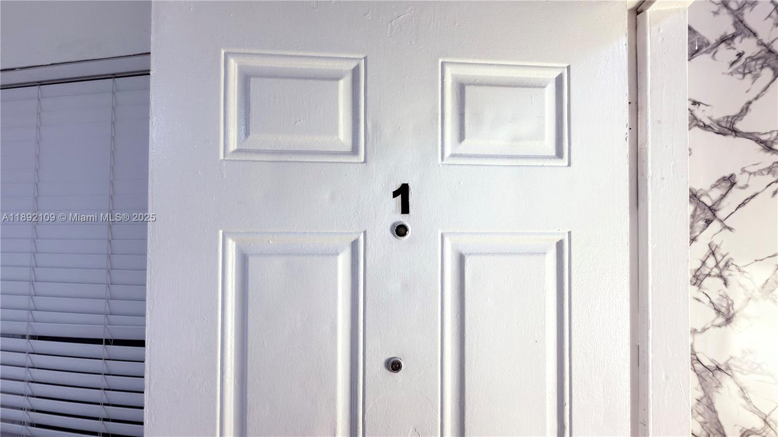 545 Michigan Avenue, Unit 1 Miami Beach, FL 33139 - Photo 8 of 12 a bathroom with a shower and a sink