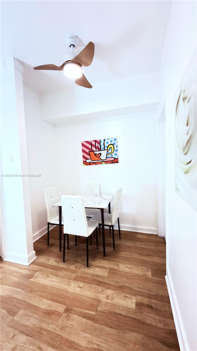 545 Michigan Avenue, Unit 1 Miami Beach, FL 33139 - Photo 10 of 12 a view of a room with furniture and wooden floor