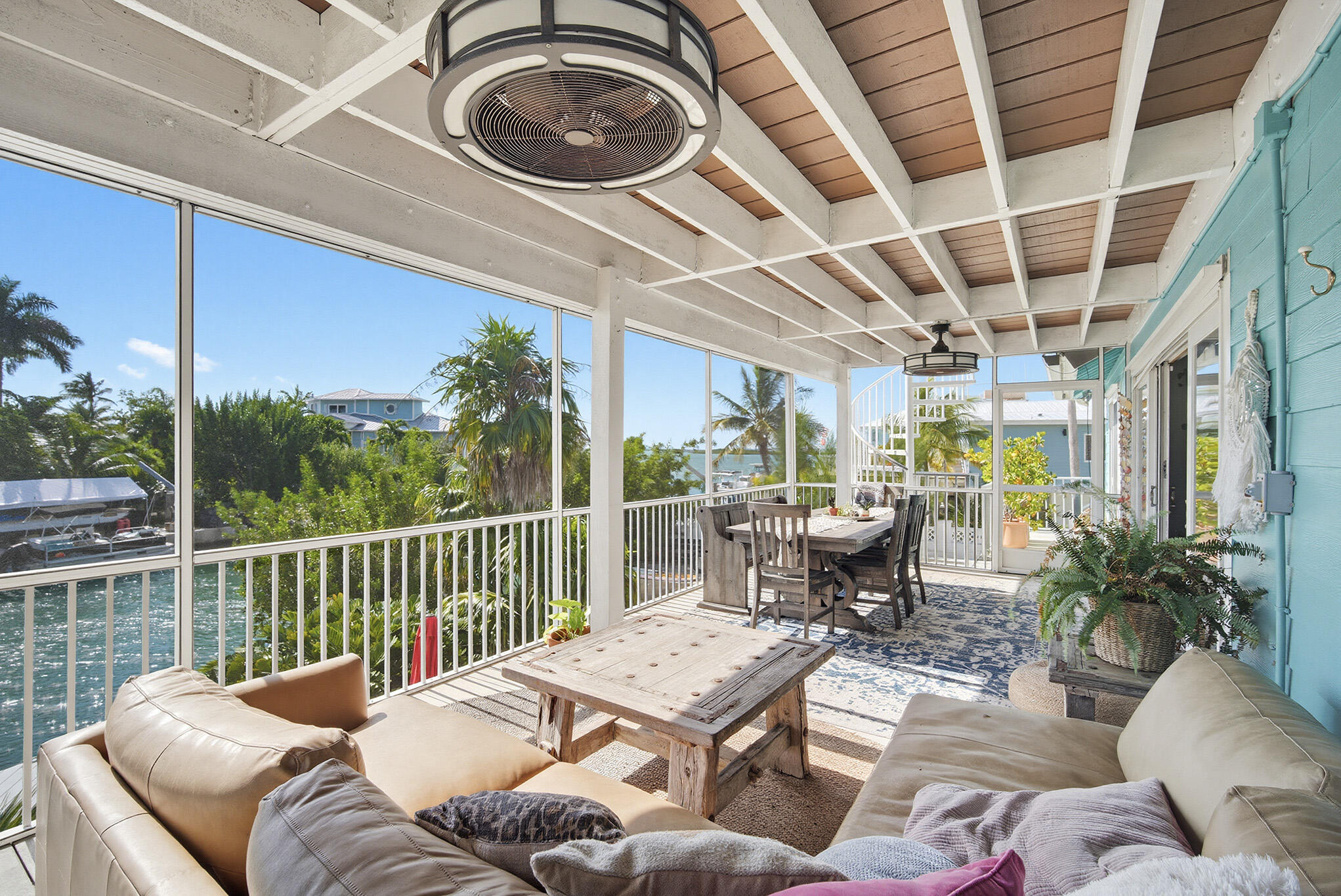 16640 Cypress Road Sugarloaf, FL 33042 - Photo 44 of 86 a view of a patio with couches table and chairs and potted plants