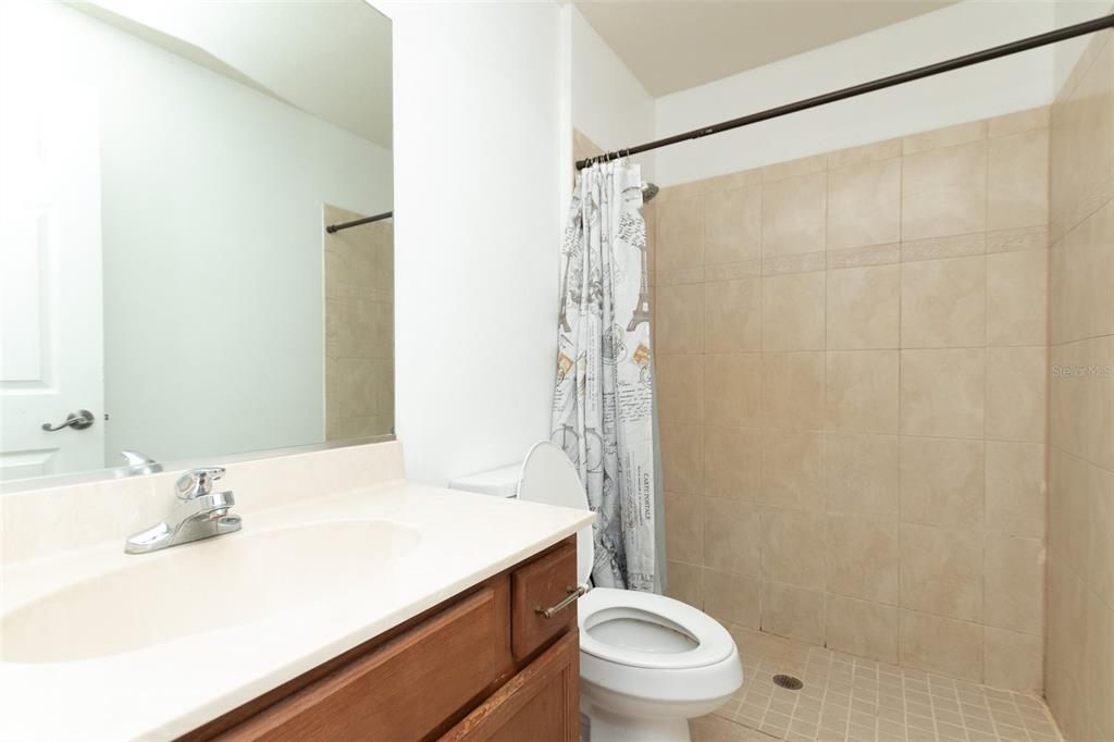 3858 Southwest 161st Street Ocala, FL 34473 - Photo 13 of 67 a bathroom with a sink a toilet and shower