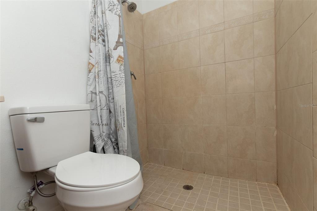 3858 Southwest 161st Street Ocala, FL 34473 - Photo 14 of 67 a white toilet sitting next to a shower