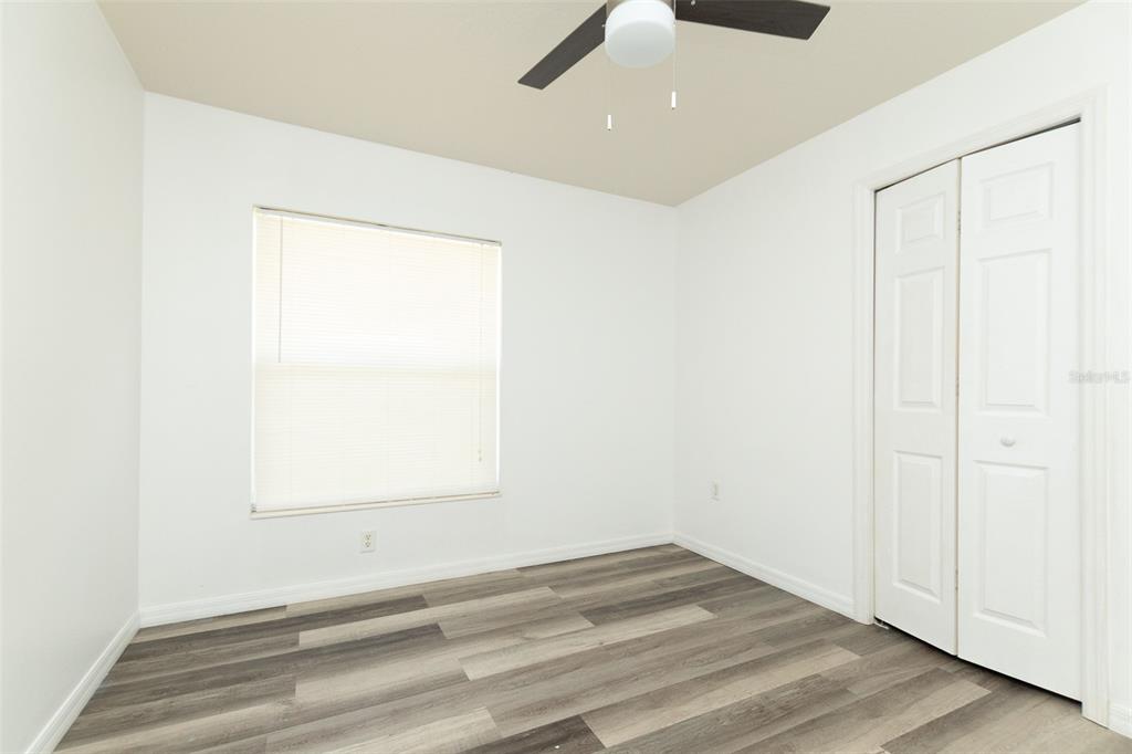 3858 Southwest 161st Street Ocala, FL 34473 - Photo 17 of 67 an empty room with a empty space and a window
