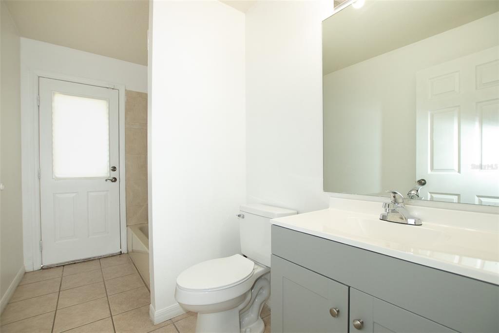 3858 Southwest 161st Street Ocala, FL 34473 - Photo 26 of 67 a bathroom with a sink toilet and vanity