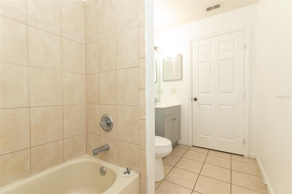 3858 Southwest 161st Street Ocala, FL 34473 - Photo 28 of 67 a bathroom with a bathtub and a shower