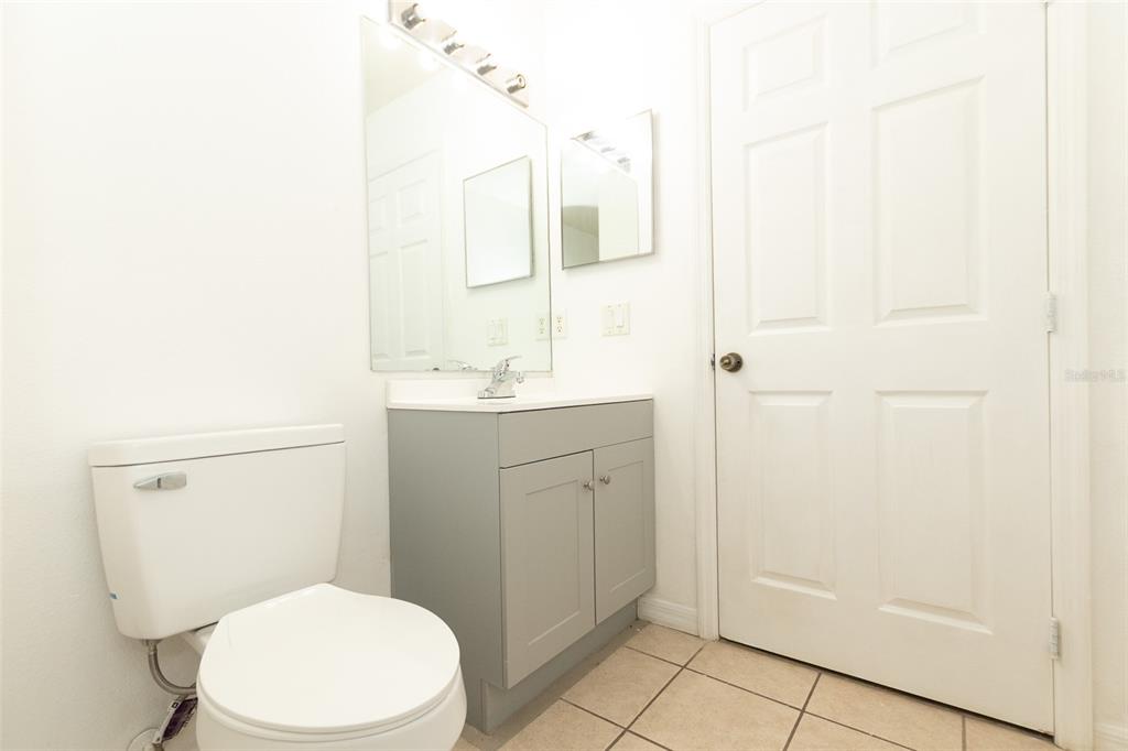 3858 Southwest 161st Street Ocala, FL 34473 - Photo 30 of 67 a white toilet sitting next to a bathroom sink