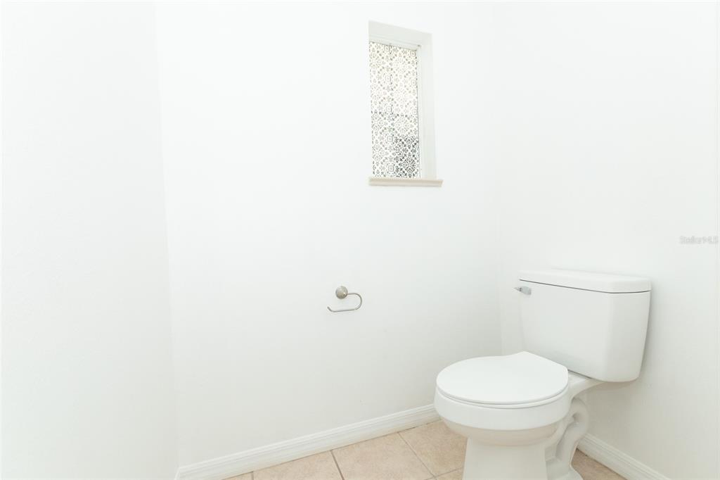 3858 Southwest 161st Street Ocala, FL 34473 - Photo 39 of 67 a white toilet sitting next to a white wall