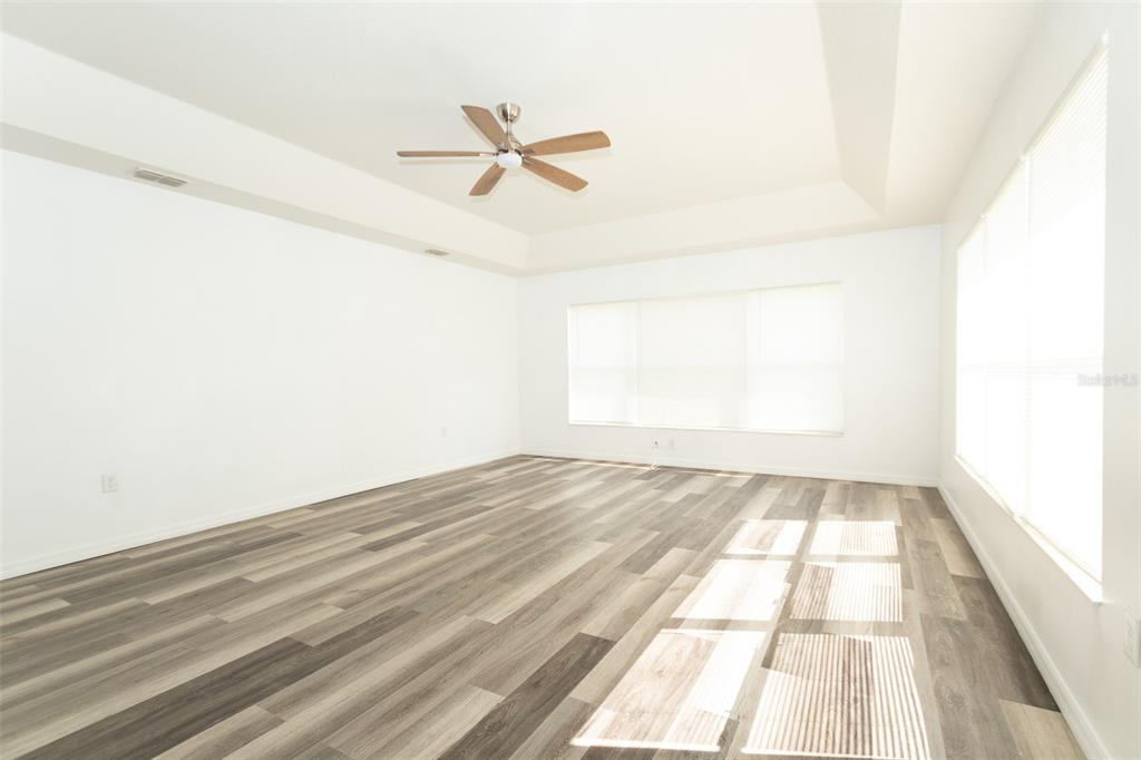 3858 Southwest 161st Street Ocala, FL 34473 - Photo 48 of 67 a view of a room with wooden floor fan and a window