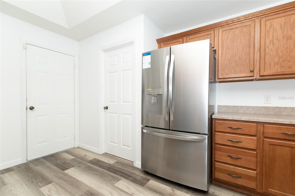 3858 Southwest 161st Street Ocala, FL 34473 - Photo 59 of 67 a kitchen with cabinets and stainless steel appliances