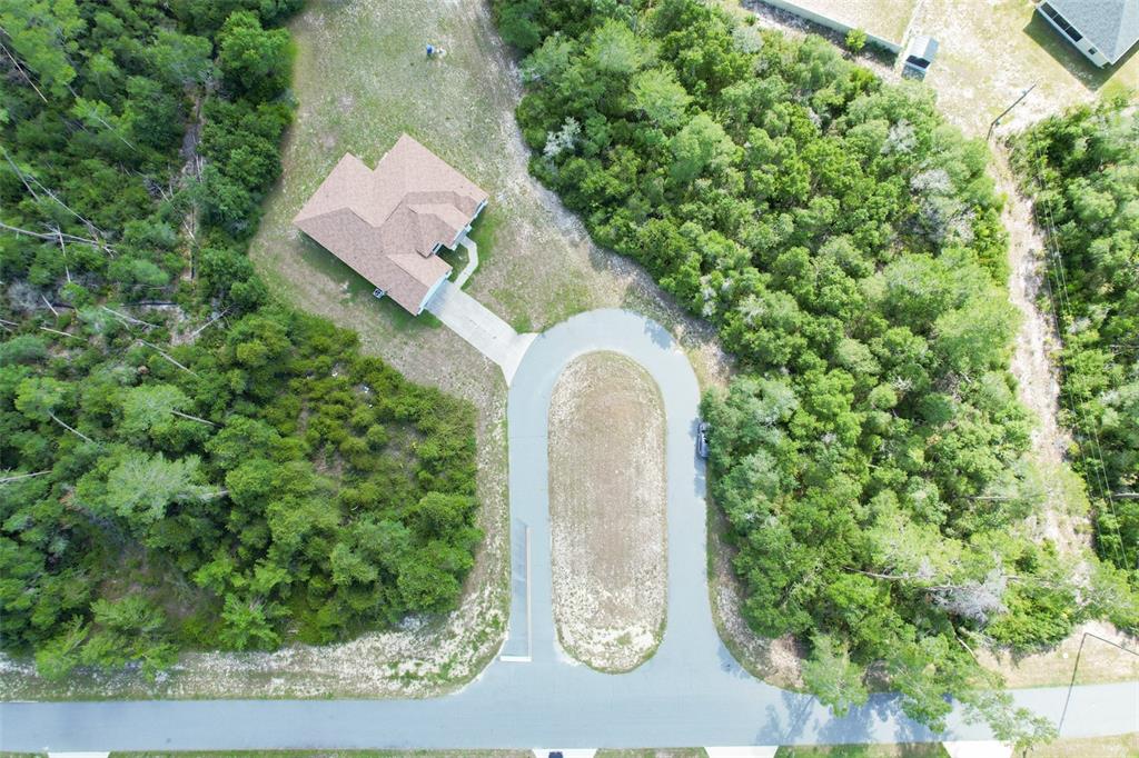 3858 Southwest 161st Street Ocala, FL 34473 - Photo 62 of 67 an aerial view of a house with a yard basket ball court and outdoor seating