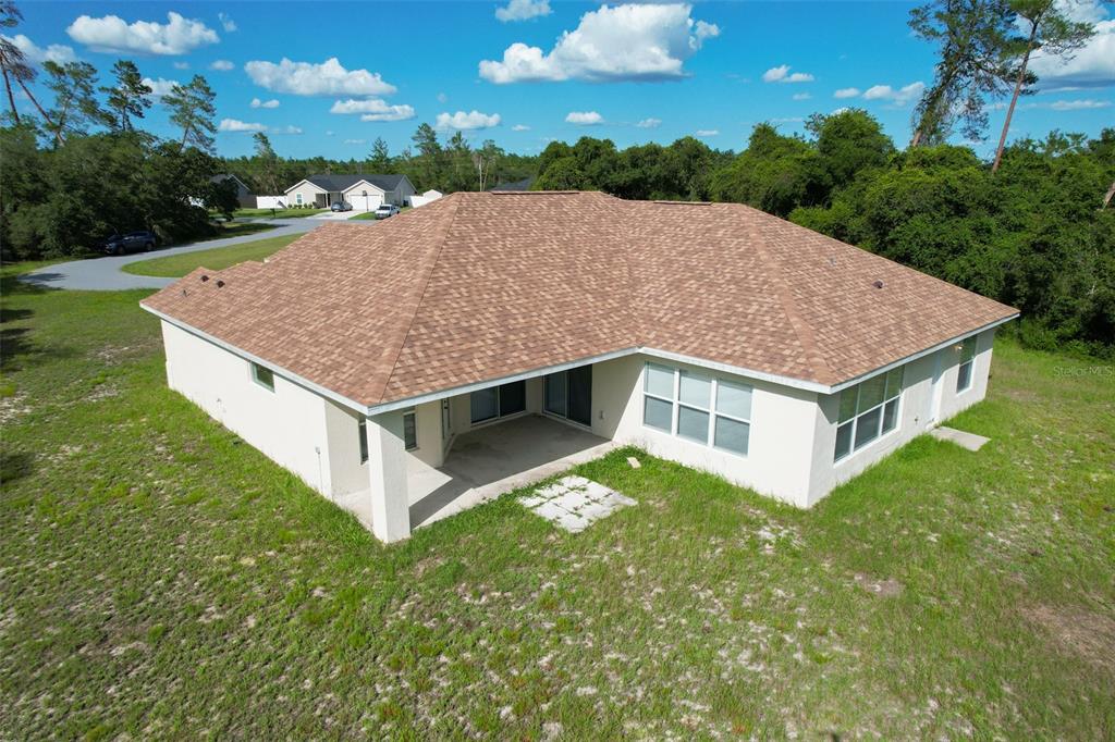 3858 Southwest 161st Street Ocala, FL 34473 - Photo 66 of 67 a aerial view of a house with yard porch and outdoor seating