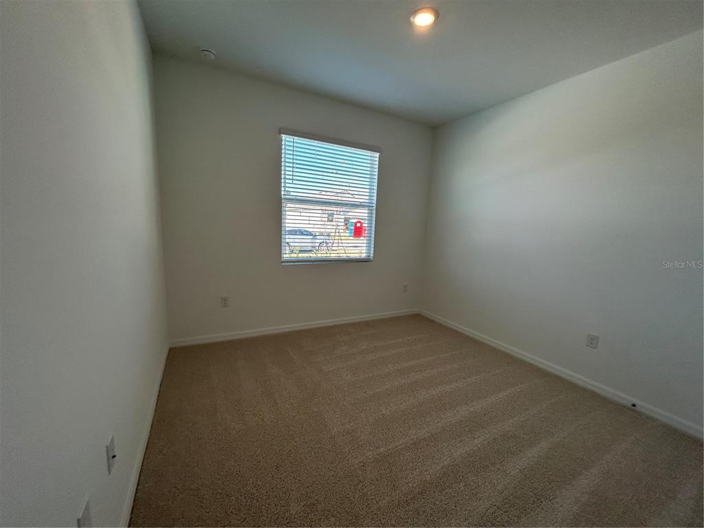 32746 Rustic Rise Road San Antonio, FL 33576 - Photo 13 of 24 an empty room with a window