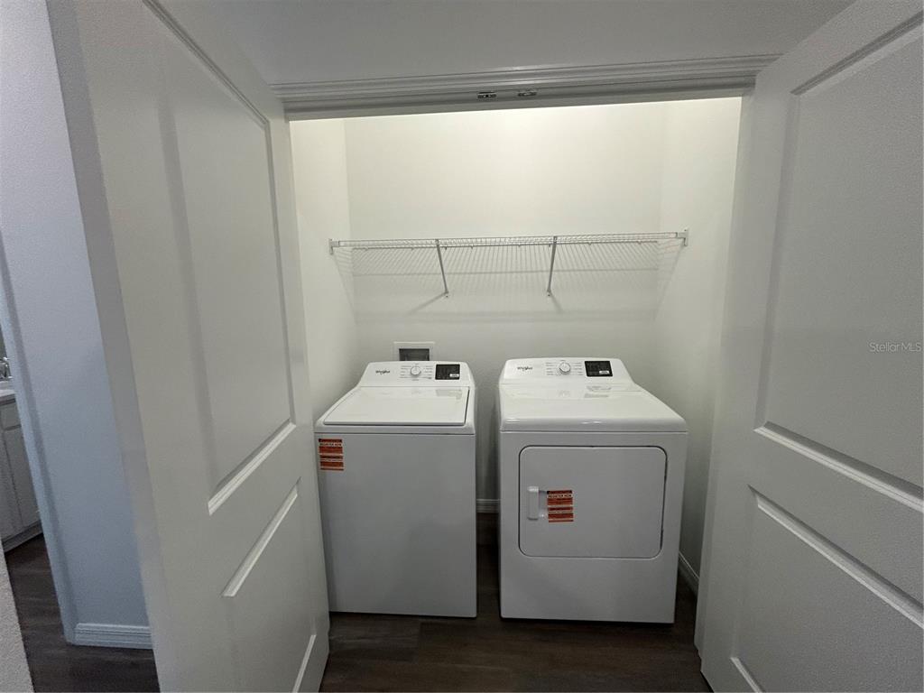 32746 Rustic Rise Road San Antonio, FL 33576 - Photo 18 of 24 a utility room with dryer and washer