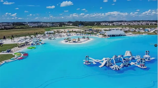 a view of a lake with a table and chairs