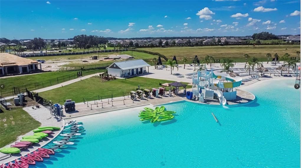 32746 Rustic Rise Road San Antonio, FL 33576 - Photo 23 of 24 a view of a lake with a building in the background