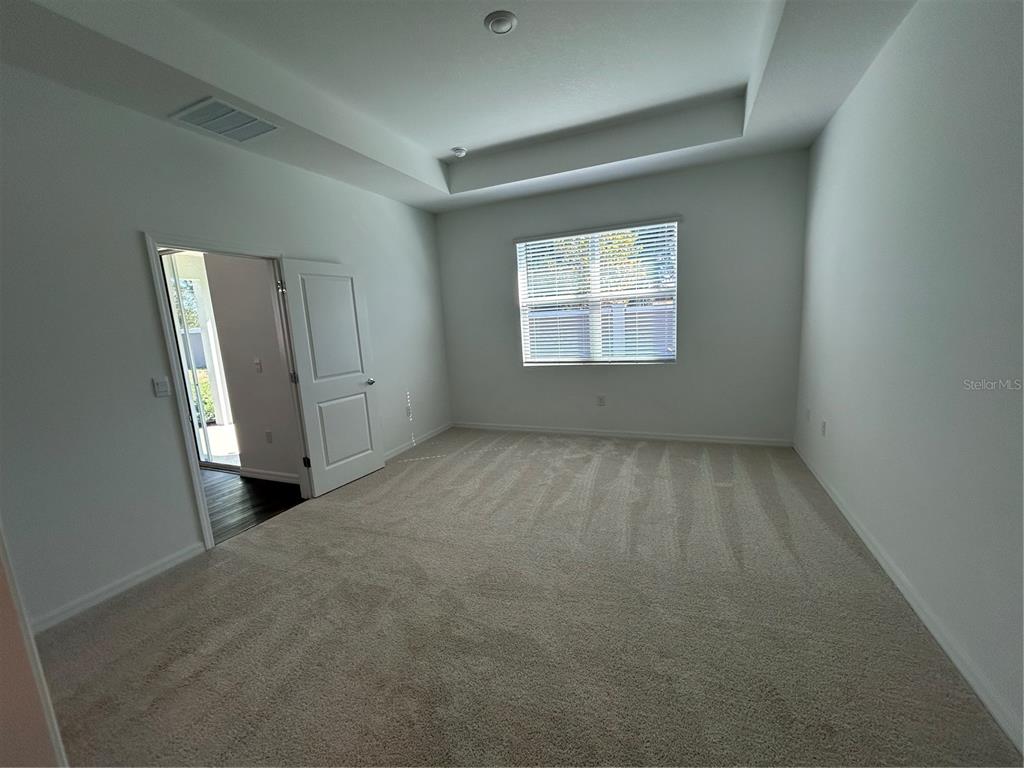 32746 Rustic Rise Road San Antonio, FL 33576 - Photo 8 of 24 an empty room with windows