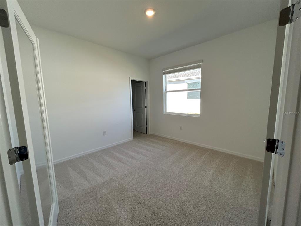 32746 Rustic Rise Road San Antonio, FL 33576 - Photo 9 of 24 an empty room with a window