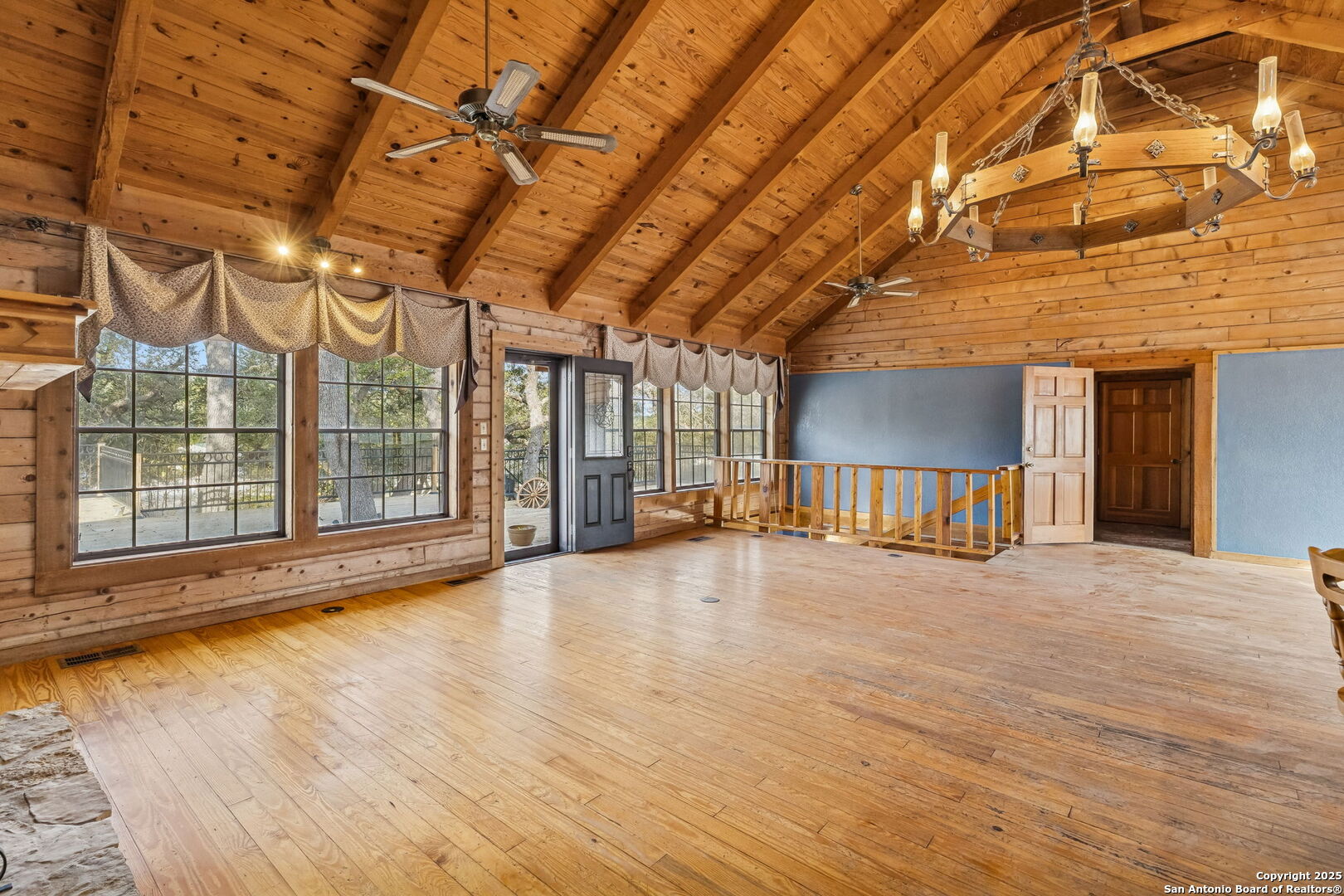 430 Stoney Ridge Bulverde, TX 78163 - Photo 20 of 94 a view of an empty room with wooden floor and a window