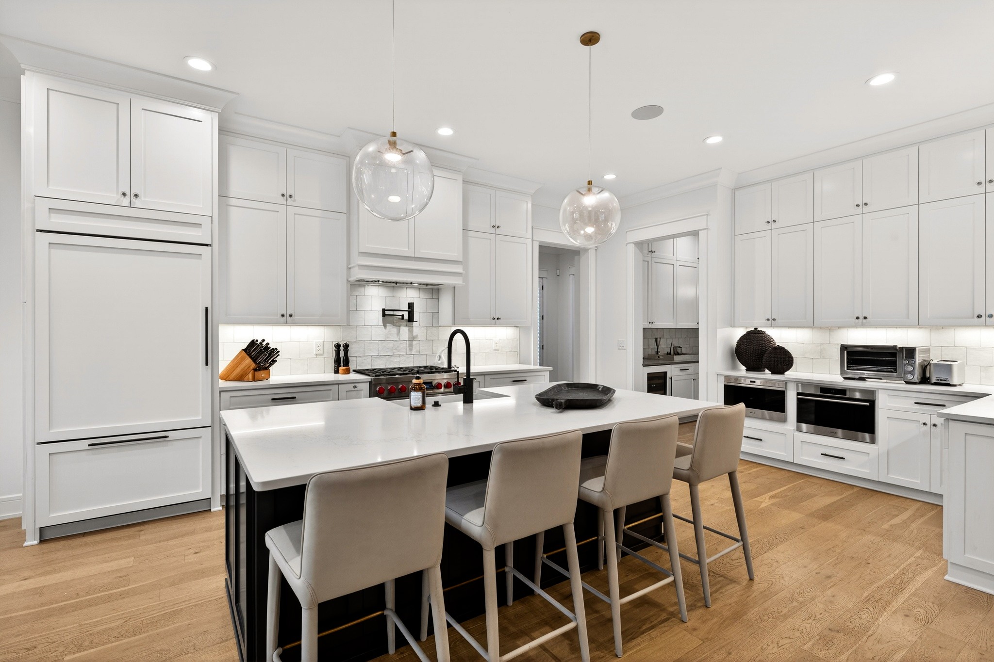 721 Newberry Road Nashville, TN 37205 - Photo 14 of 49 a kitchen with granite countertop a table chairs stove and white cabinets