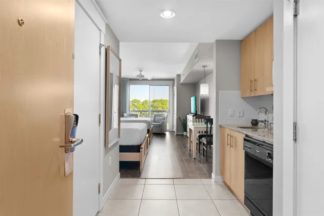 a kitchen with a refrigerator and a stove