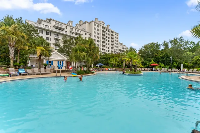 a view of a swimming pool and lounge chair