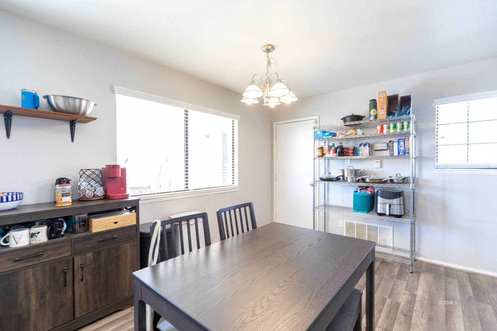 332 Sims Street Ridgecrest, CA 93555 - Photo 12 of 29 a view of a dining room with furniture and a window