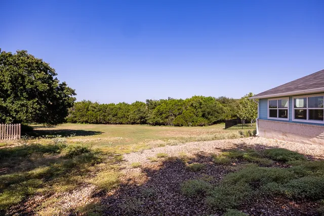 a view of a lake with a house in the background