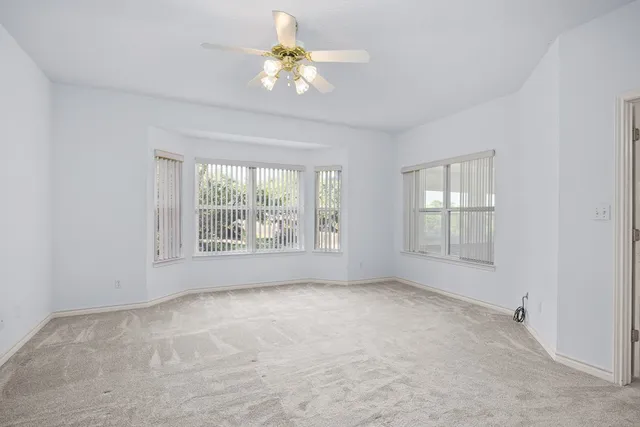 an empty room with a empty space and a window