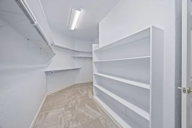 a view of an empty walk in closet