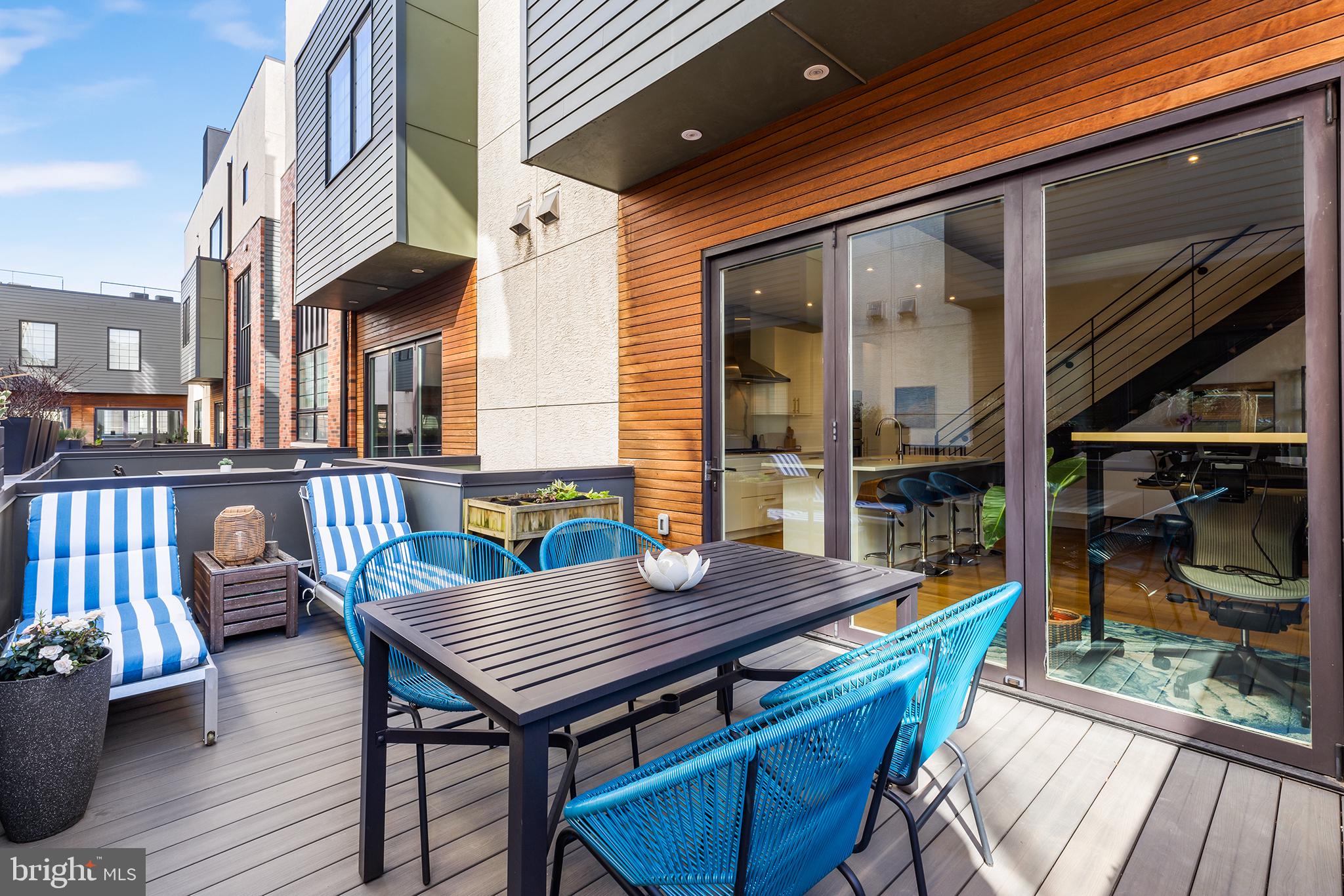 1124 Shackamaxon Street, Unit 8 Philadelphia, PA 19125 - Photo 17 of 41 a view of a deck with wooden floor and seating space