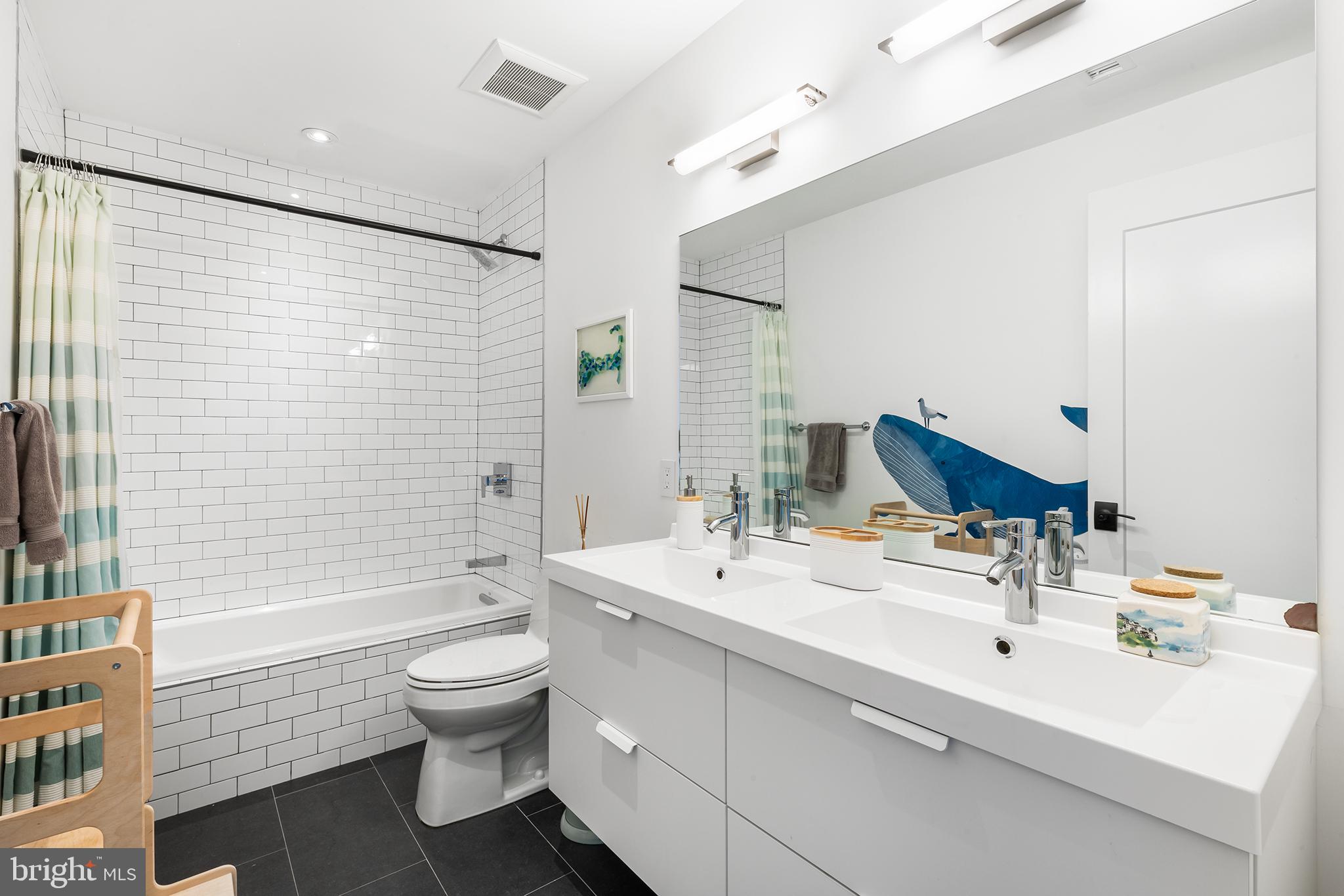 1124 Shackamaxon Street, Unit 8 Philadelphia, PA 19125 - Photo 20 of 41 a bathroom with a sink toilet tub and shower