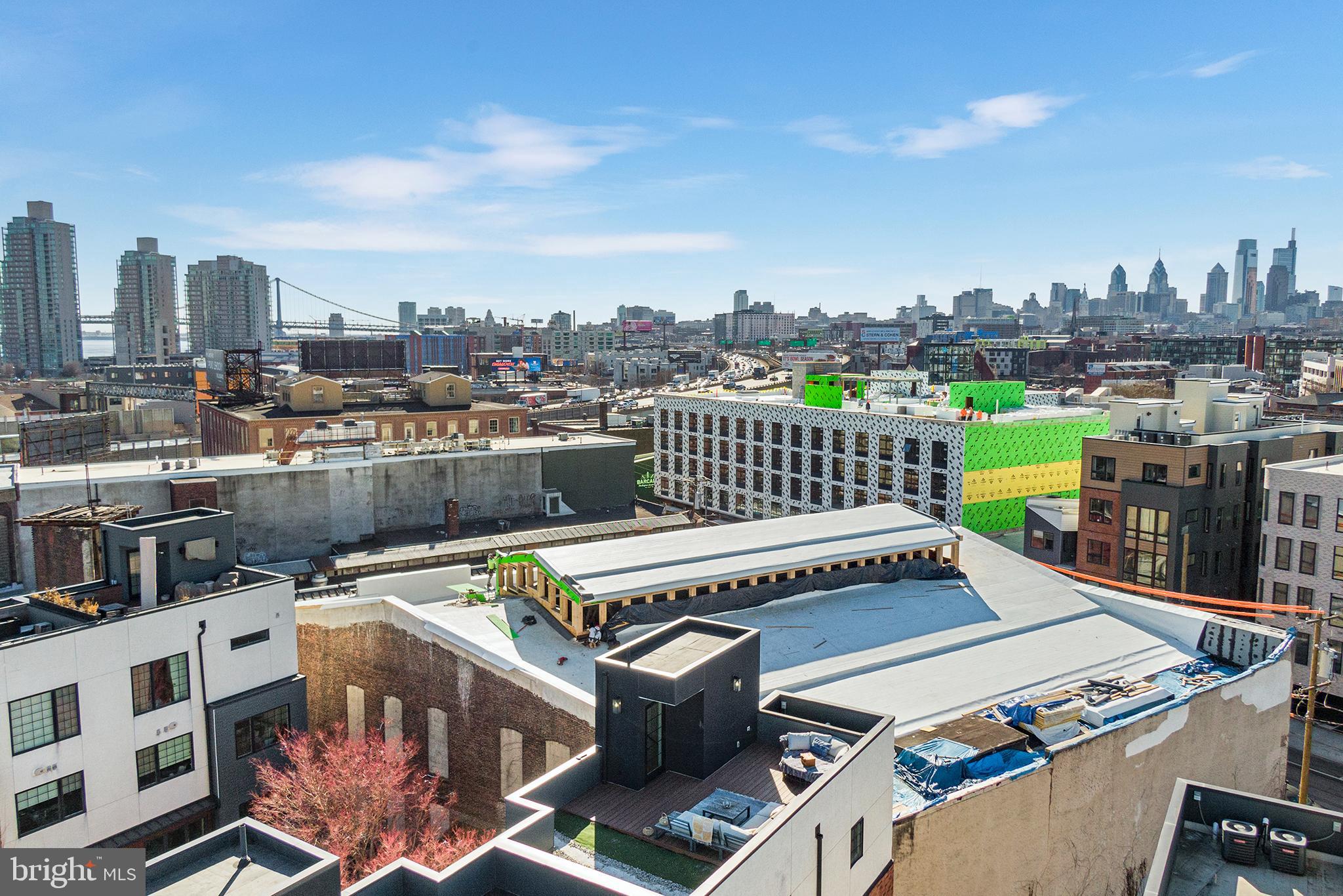 1124 Shackamaxon Street, Unit 8 Philadelphia, PA 19125 - Photo 38 of 41 a terrace with a bench and city view