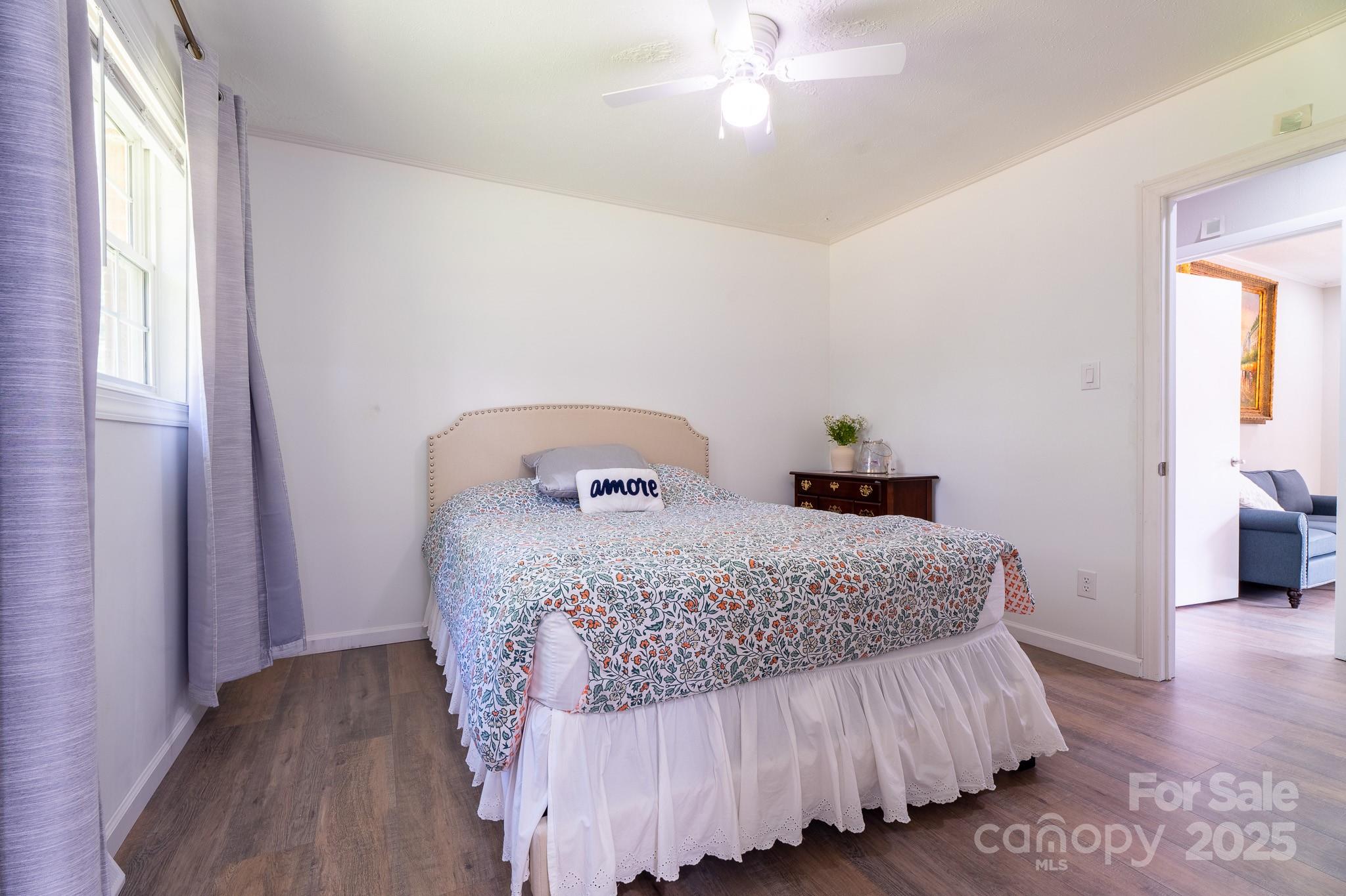 584 Southside Church Road Lincolnton, NC 28092 - Photo 14 of 28 a bedroom with a bed and wooden floor
