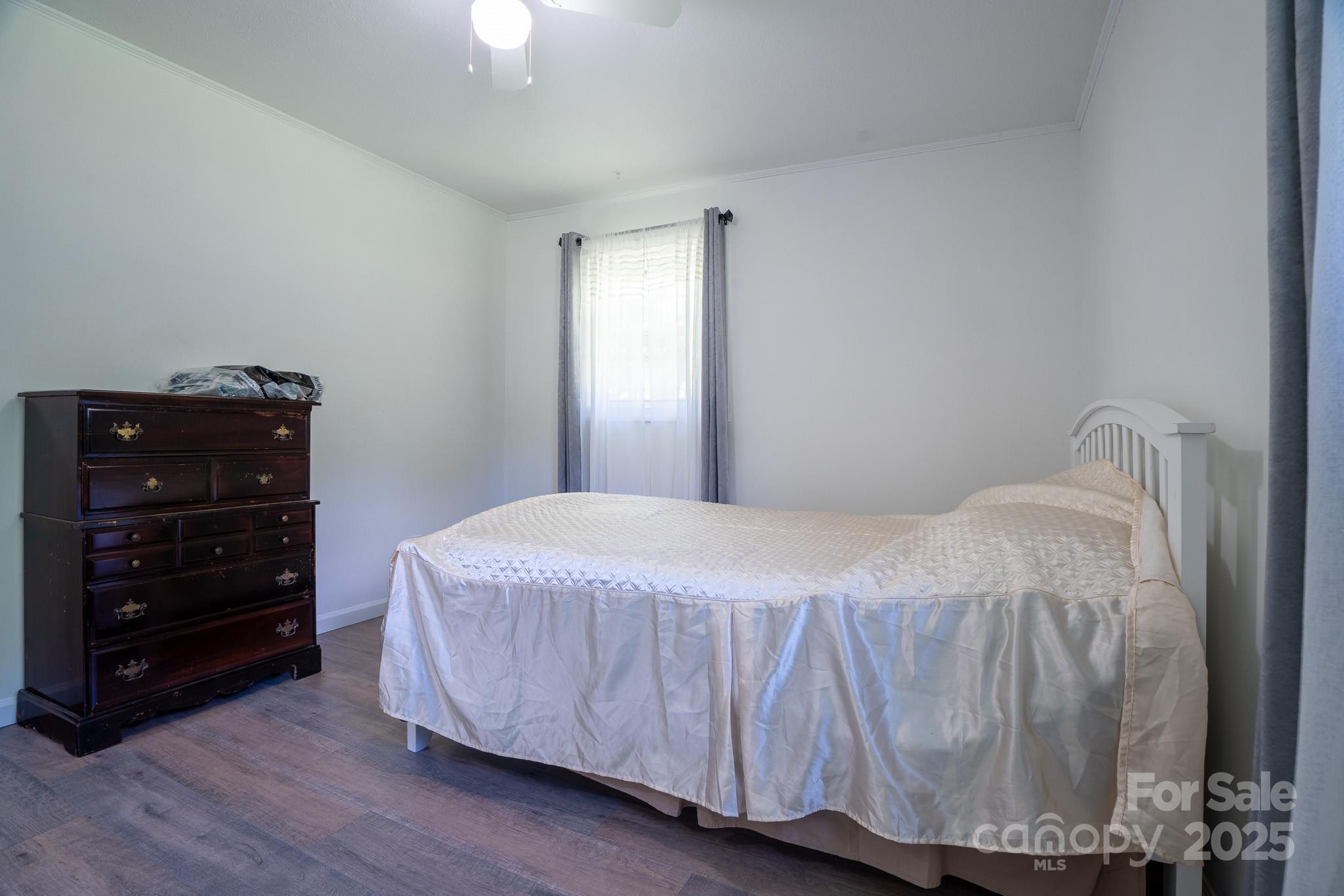 584 Southside Church Road Lincolnton, NC 28092 - Photo 18 of 28 a bedroom with a bed and a dresser