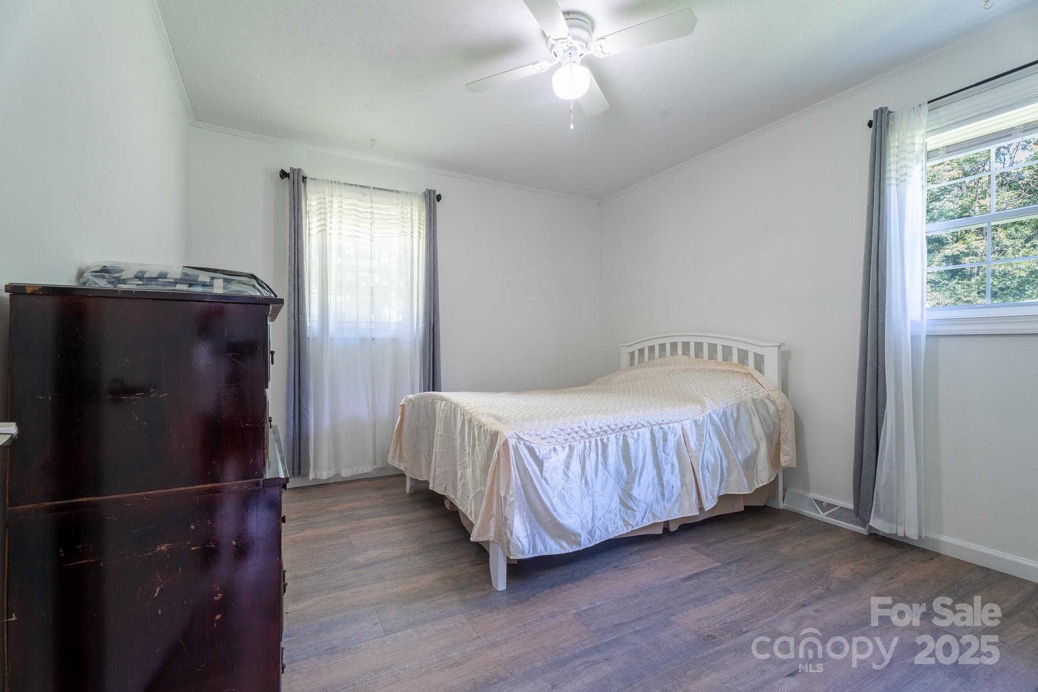 584 Southside Church Road Lincolnton, NC 28092 - Photo 19 of 28 a spacious bedroom with a bed and a window