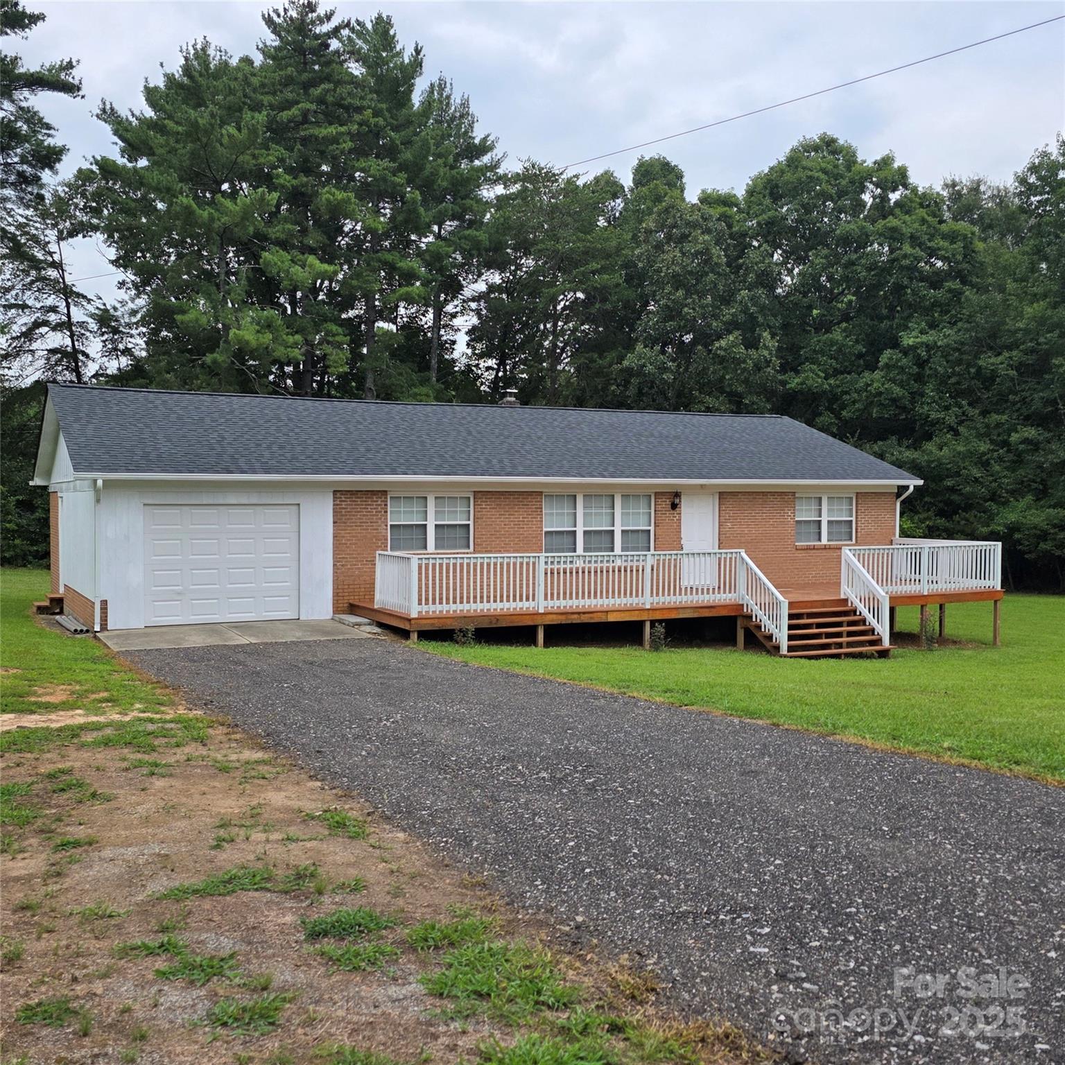 584 Southside Church Road Lincolnton, NC 28092 - Photo 2 of 28 a view of a yard in front of a house with large tree