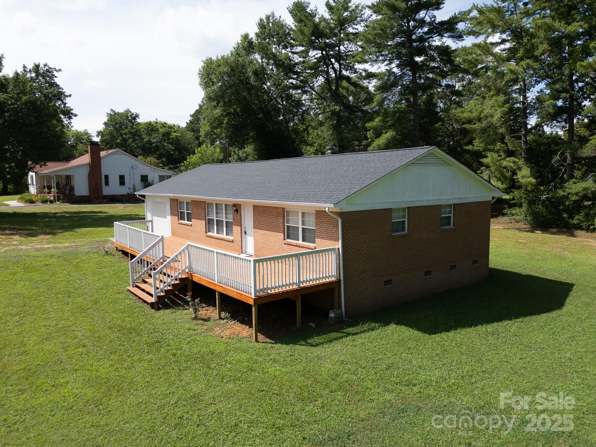 584 Southside Church Road Lincolnton, NC 28092 - Photo 26 of 28 a aerial view of a house with a yard and sitting area