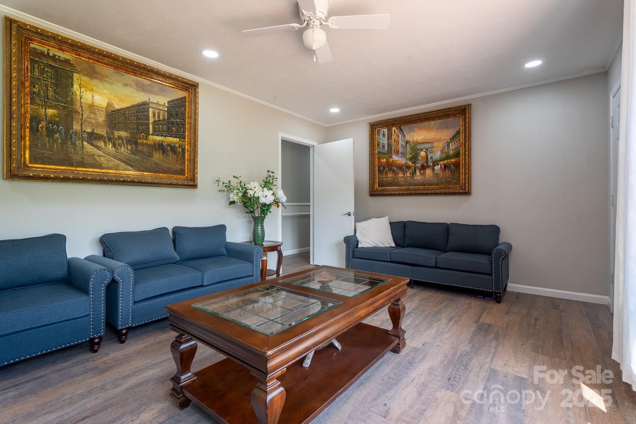 584 Southside Church Road Lincolnton, NC 28092 - Photo 8 of 28 a living room with furniture and a wall painting