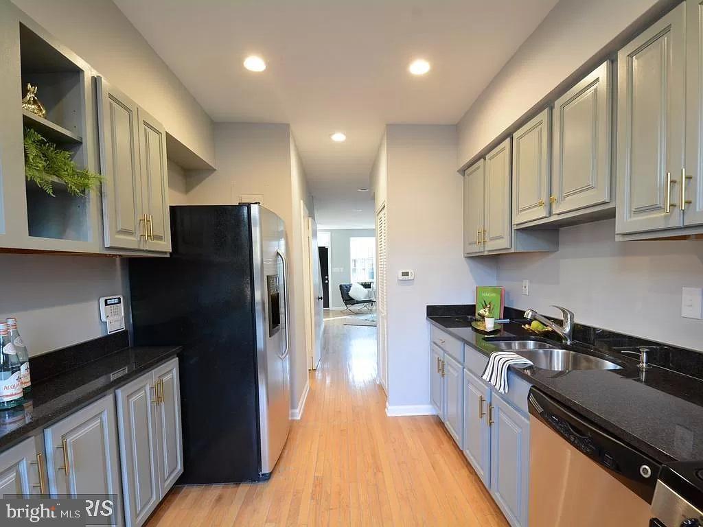 624 14th Place Northeast Washington, DC 20002 - Photo 9 of 22 a kitchen with granite countertop a refrigerator a stove top oven a sink and dishwasher