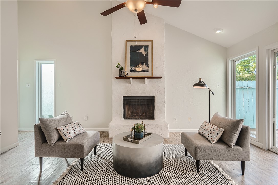 a living room with furniture and a fireplace