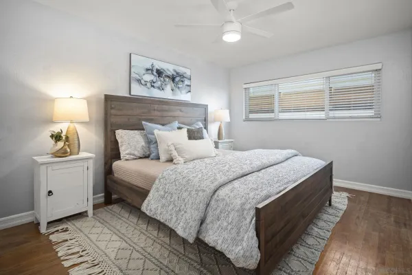 a bedroom with bed and window