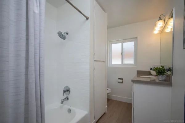 a bathroom with a bathtub and a sink