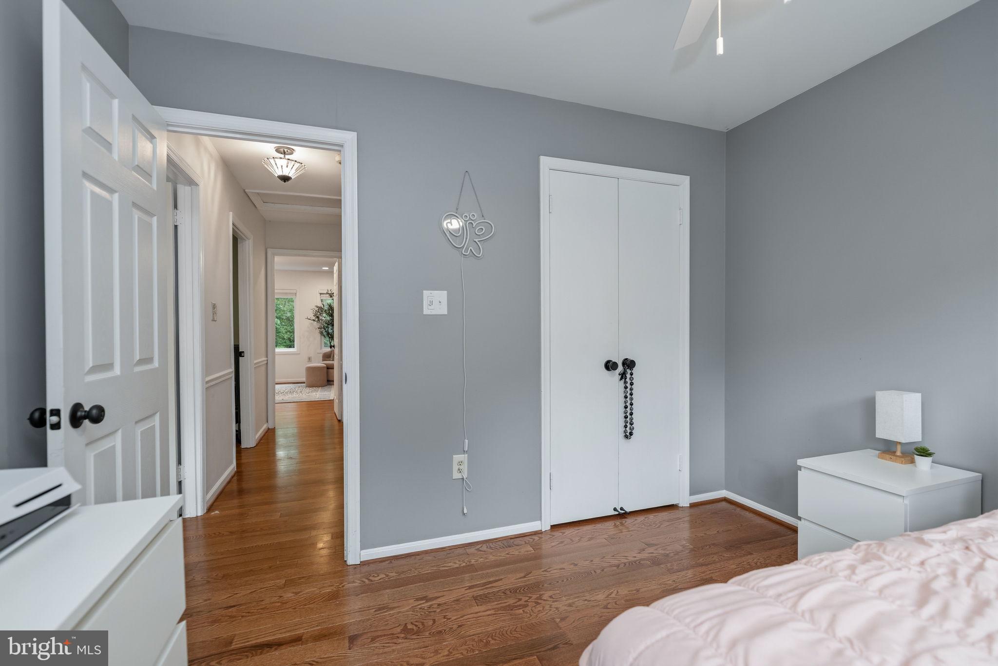 7603 Modisto Lane Springfield, VA 22153 - Photo 28 of 57 a bedroom with a bed and wooden floor