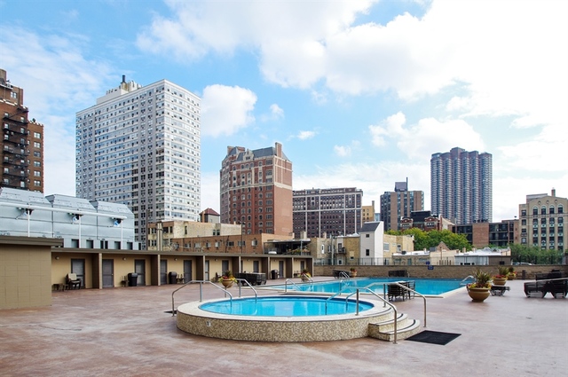 655 West Irving Park Road, Unit 4103 Chicago, IL 60613 - Photo 18 of 25 a view of balcony with patio and lake view