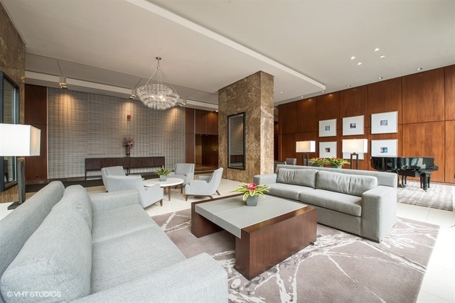 655 West Irving Park Road, Unit 4103 Chicago, IL 60613 - Photo 19 of 25 a living room with furniture and a large window